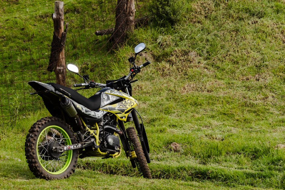 A motocross bike parked on lush green grass in La Marquesa, Mexico.